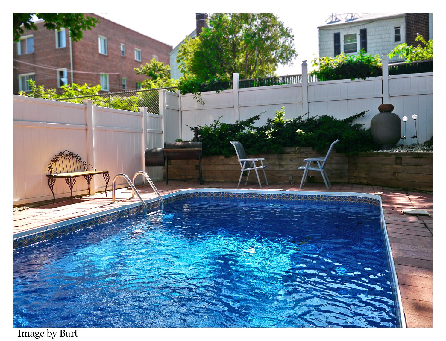 Two family home for sale Middle Village Queens with an in ground pool